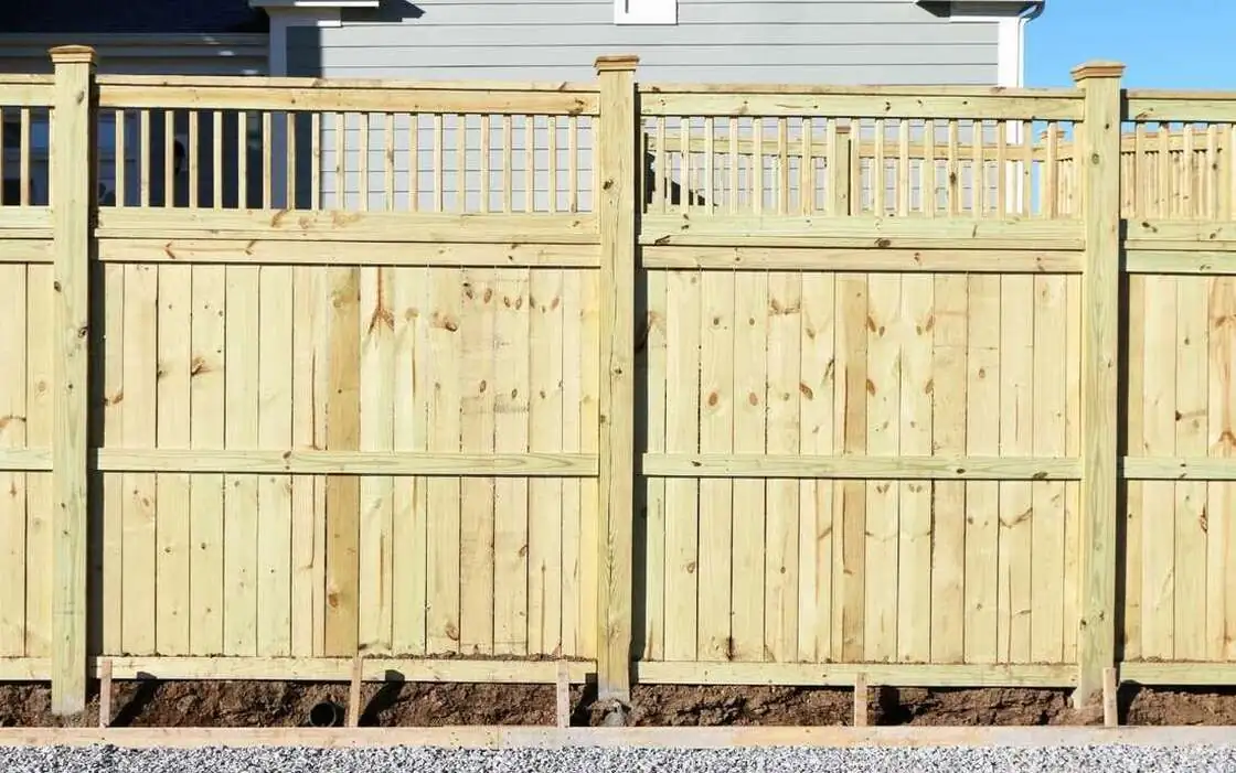 New wood privacy fence with a decorative lattice top